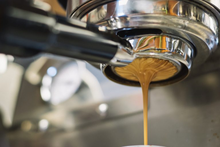 Espresso pouring through a bottomless portafilter