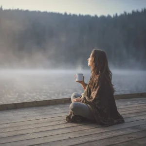 sitting on a dock with a coffee square